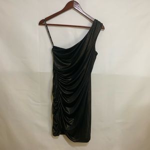 Cute little black dress with gold shimmer! NWT